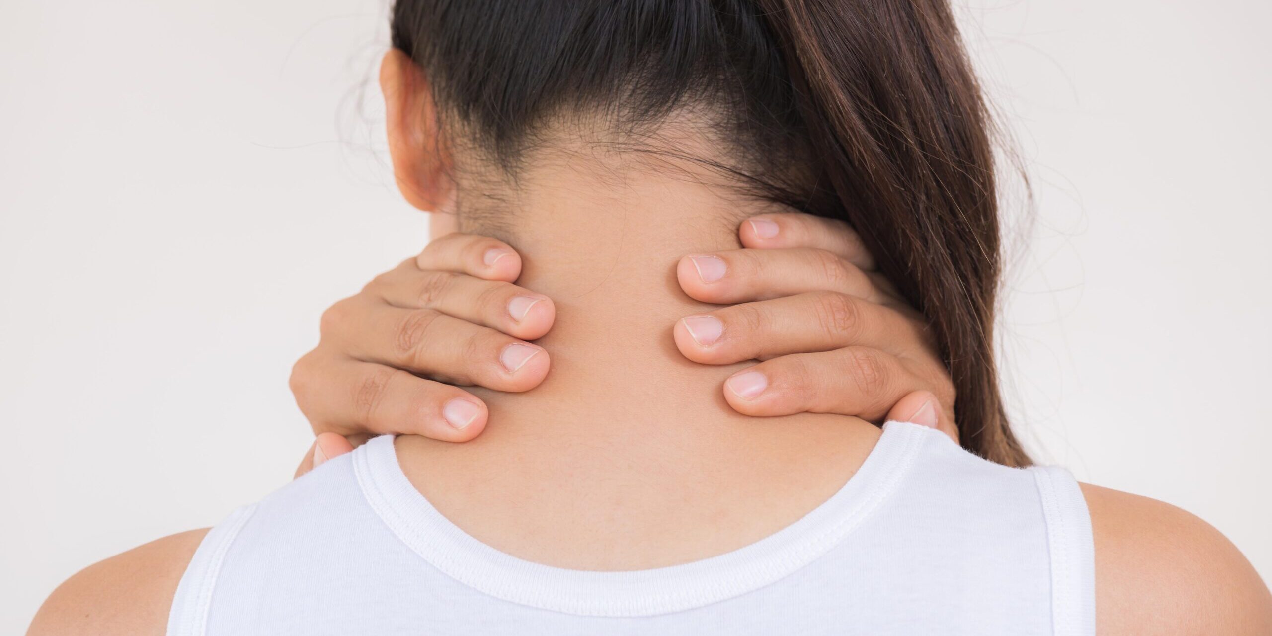 Closeup woman neck and shoulder pain and injury. Health care and